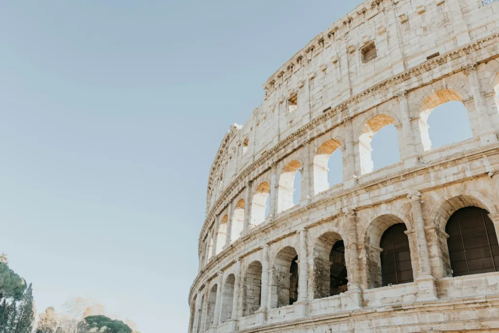 Close view of the exterior arches of the Colosseum in warm daylight
