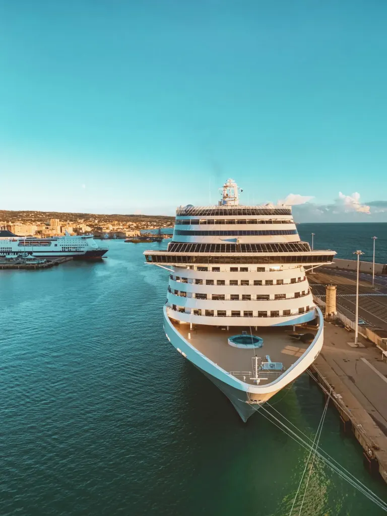 A cruise ship berthed in a turquoise harbour