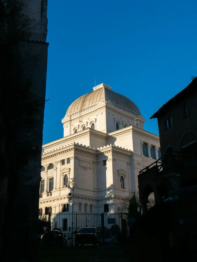 The aluminium dome of the Great Synagogue of Rome against a blue sky