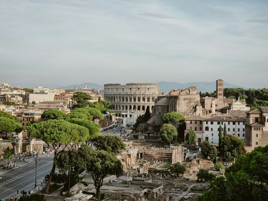 View over the Roman Forum and the Colosseum from above the city rooftops