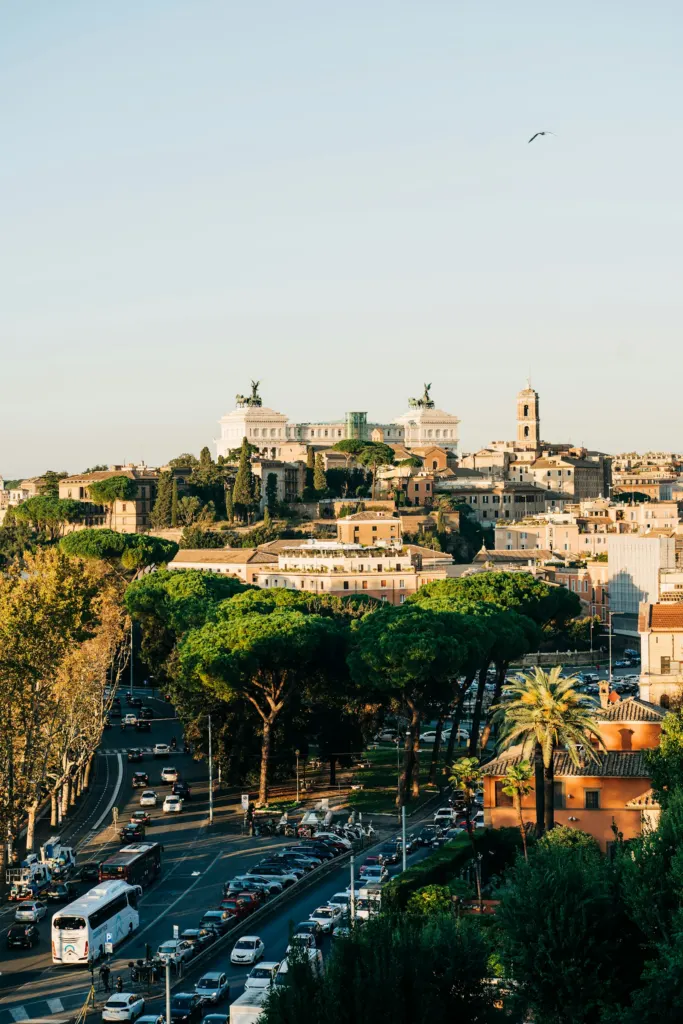 Rome rooftops and umbrella pines below the white marble Vittoriano monument