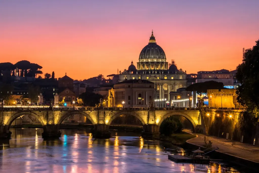 Sunset over the Tiber with St Peter's dome and Ponte Sant'Angelo